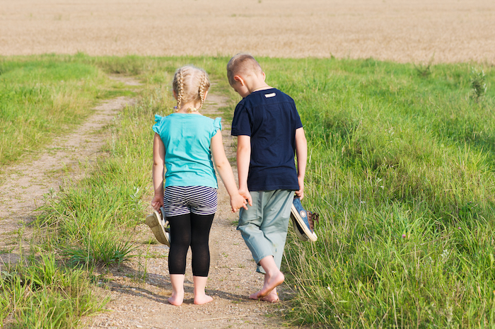Children walking barefoot